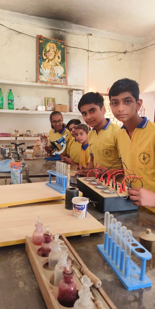 Students conducting science experiments in modern laboratory - Vikas Public School